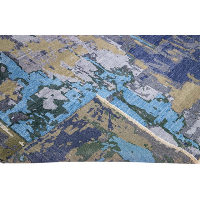 Beautiful modern Indian hand-knotted wool and silk rug with a blue field. This Modern rug with an abstract design has...