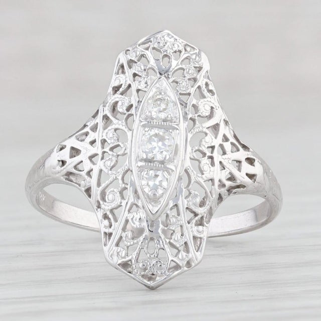 Gemstone Information: - Natural Diamonds - Total Carats - 0.12ctw Cut - Single & Transitional Round Brilliant Color - G -...