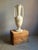 A monumental neoclassical revival alabaster amphora urn lamp. The alabaster stone is warm shades of cream with gray veins...