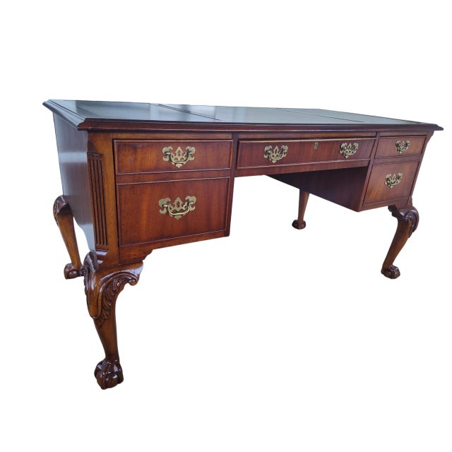 Beautifully restored Hekman mahogany writing desk in the classic Chippendale style. This elegant desk features three inset...