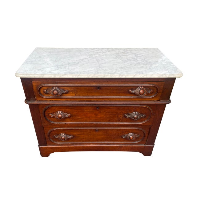 Mid to late 1800s walnut marble-top dresser with carved drawer pulls in gorgeous condition. Previous owner took great care...