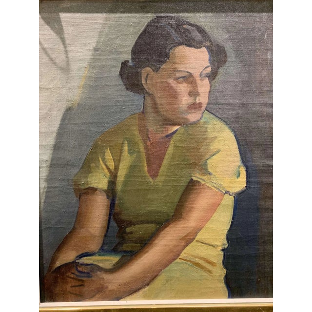 Circa 1930 framed oil painting on canvas of a young woman in a yellow dress. By Finnish artist Llmari Aalto who was...
