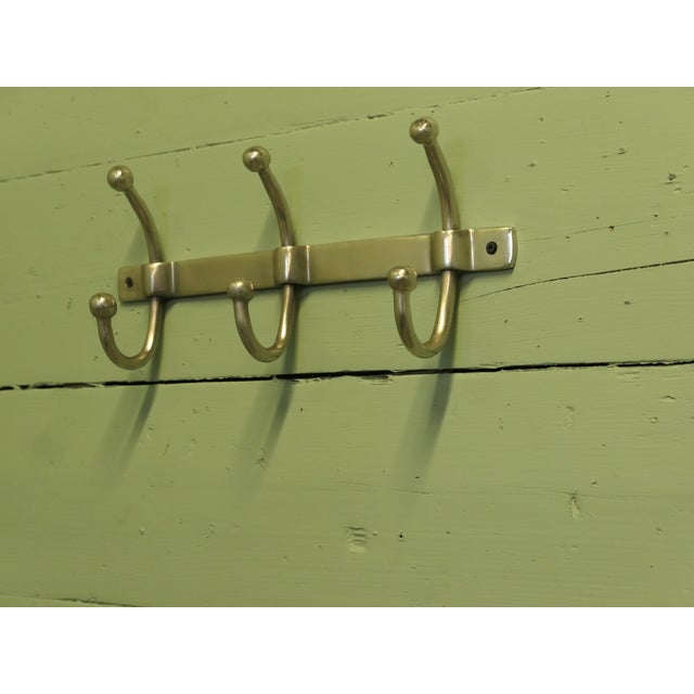 Very Stylish Chrome Cloakroom Coat Rack The rack has 3 double swan neck hooks The bracket is 9” tall, 17” long and stands...