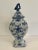 Dutch Delft blue and white ceramic lidded urn vase with bird on the lid. Hand painted vessel has a blue and white...