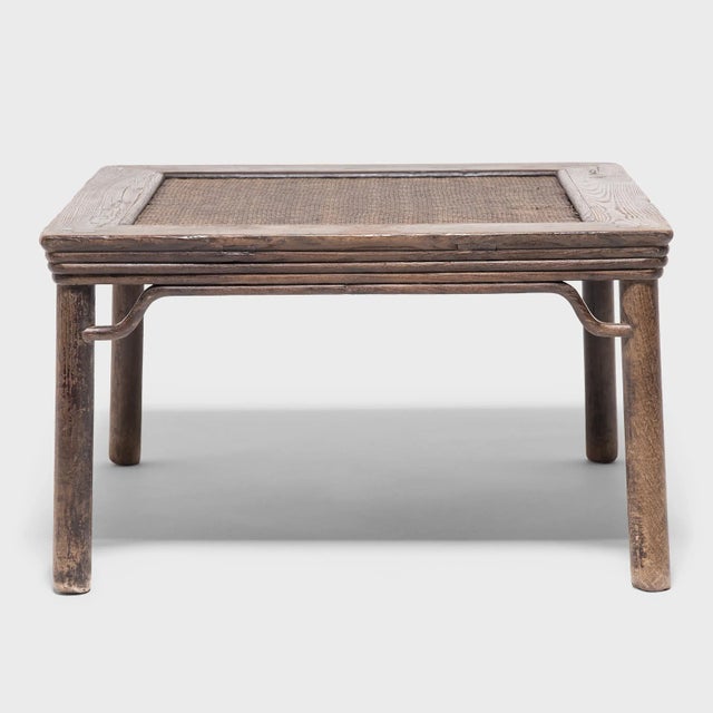 Curving spandrels, a stepped apron, and subtly splayed legs epitomize the simple grace of this 19th-century square stool,...