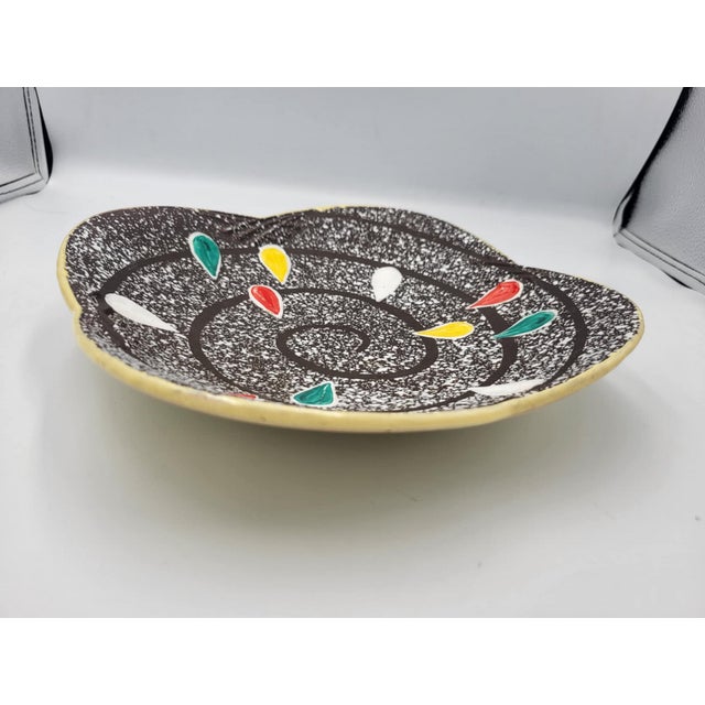 Ceramic plate, German, 1950s-60s, dimensions: height 5.5 cm, width 24.5 cm, depth 24.5 cm.