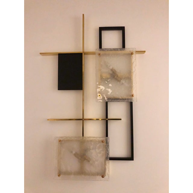 Two large brass and glass wall lamps, Italy, 1985 European Plug (up to 250V).The wiring of this item may be original and...