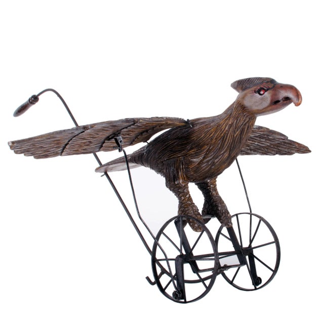 American carved and painted eagle push toy, 20th century. Wrought iron frame mechanism in good working condition. Pushing...
