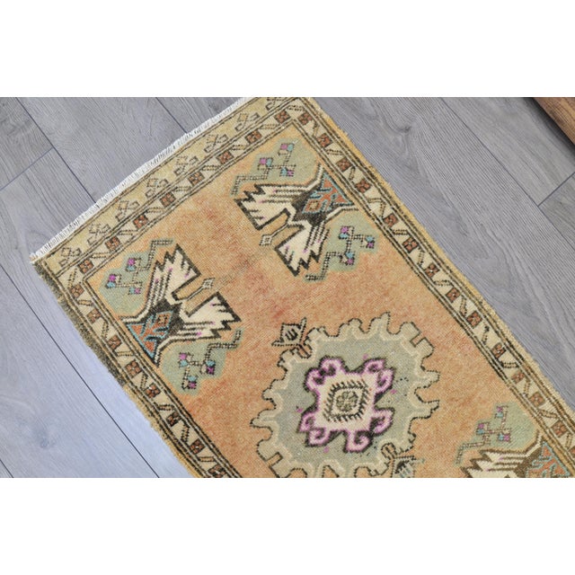 This is a vintage Turkish Oushak rug from the 1960s. The piece was hand-knotted.