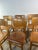 Six vintage Thonet chairs in beech and beech veneer, featuring a simple and timeless design characteristic of mid-20th-...