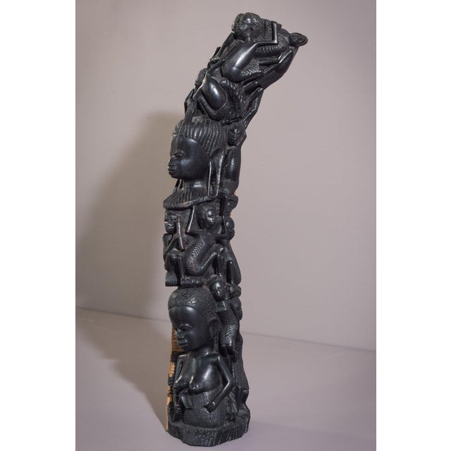 This carved african figural post is an incredibly unique and truly special piece. Many of the intertwined figures depicted...