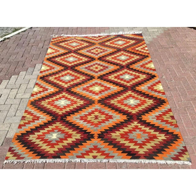 This beautiful, vintage, handwoven kilim is approximately 60 years old. It is handmade, of very fine quality hand spun...