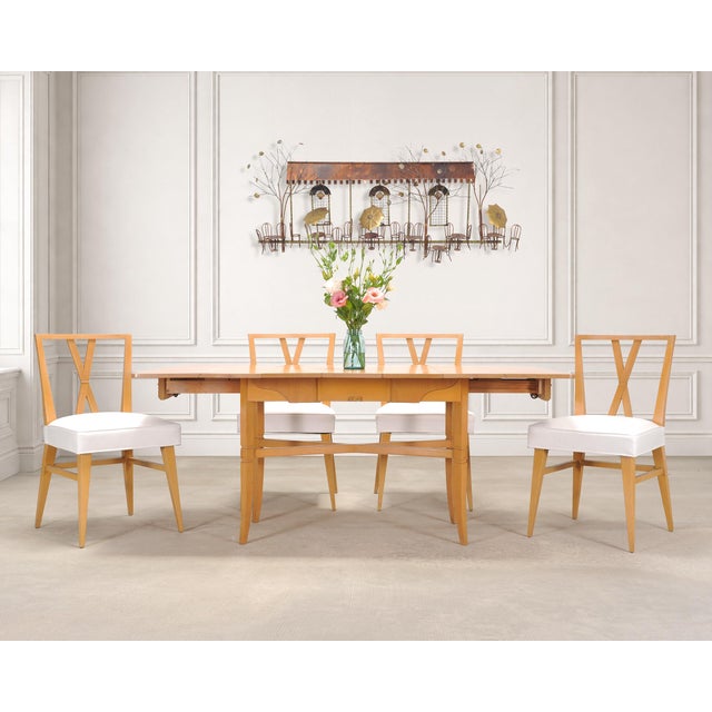 A beautifully crafted mid-century modern brass and metal wire wall sculpture measuring nearly 4 feet wide depicting an...