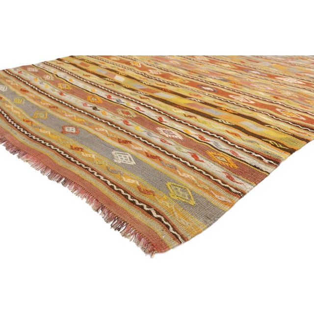 51282 Vintage Turkish Kilim Rug, 05’04 x 06’09. Infusing the essence of Southwest Boho Chic with tribal enchantment, this...