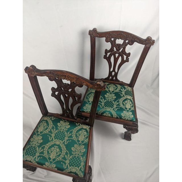 Beautiful pair of antique carved wood children's chairs, featuring exceptionally detailed carving, graceful proportions,...