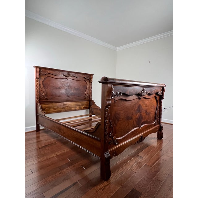 Exceptional Early 20th Century carved burlwood full size bed. This hand crafted bed features elegant floral curvings, wood...