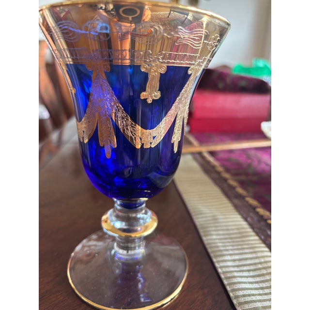 Elevate your table with this stunning pair of “Arte Italica Vetro” wine glasses. These masterfully crafted jewel tone blue...