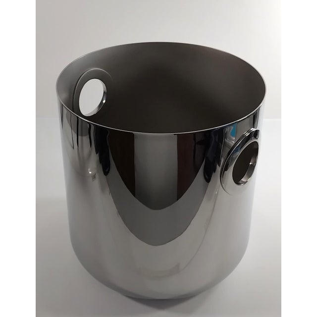 A sleek, contemporary stainless steel champagne bucket from the luxury French silversmith Christofle, belonging to the...