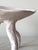 BOWL - RAÍZ terracotta with underglaze Three legs, each curved and hand-built, holding a shallow bowl above the surface....