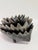 A vintage Walter Bosse cast iron hedgehog figurine featuring a set of 6 nesting hedgehogs the designer’s signature...