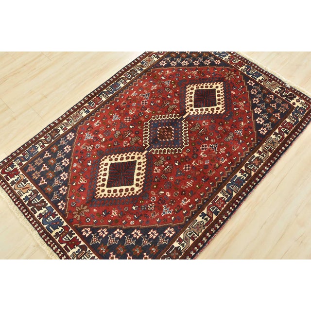 An authentic vintage tribal Yalameh rug hand-knotted with fine wool and natural dyes. This finely woven nomadic rug...