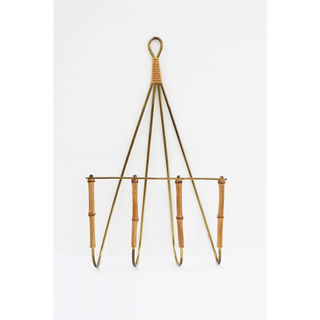Wall-mounted magazine rack Brass/Bamboo Austria, 1950s In the Carl Auböck style Height 45.5 cm, Width 27 cm, Depth 8.5 cm...