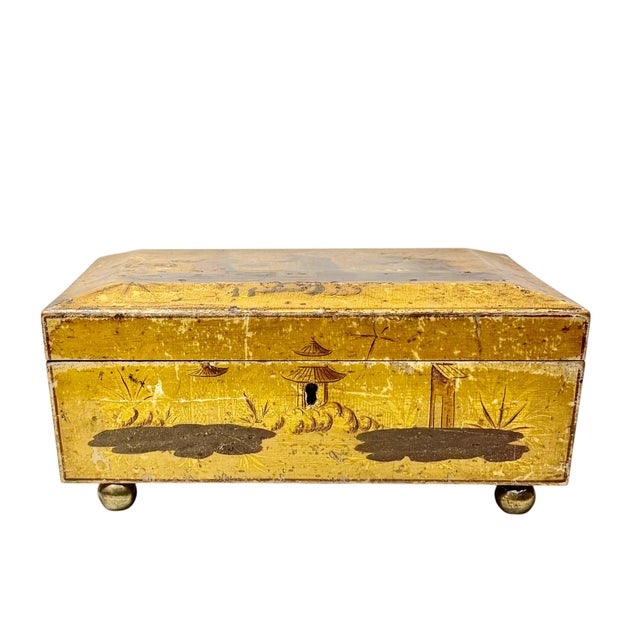 An elegant 19th century English regency work box decorated in the chinoiserie taste with intricate pinwork detailing and...