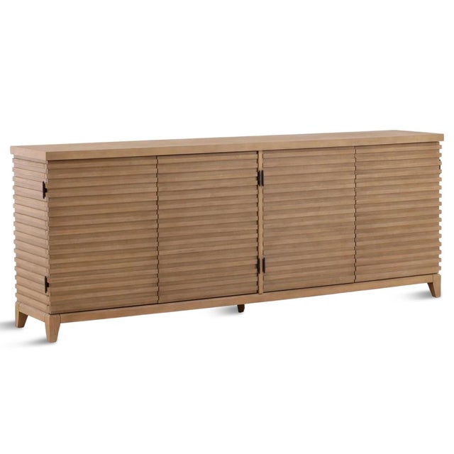 Crafted from solid acacia wood with a light warm washed finish, this sideboard combines clean lines with organic...