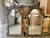 A pair of elegant giltwood wall mirrors handcrafted in Italy in the Early 20th Century. The frames have intricate, hand-...