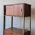 c. 1960s. Modular freestanding unit with secretary desk. Walnut wood with omni metal rods. This piece is attributed to the...