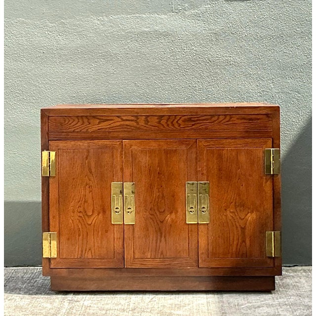 Elevate your entertaining space with this exceptional vintage Henredon dry bar cabinet, a masterful representation of...