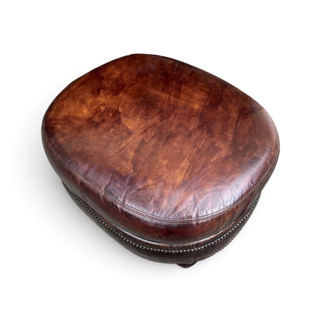 Brown Vintage Oval Brown Leather Ottoman With Brass Nailhead Trim and Carved Wood Feet For Sale - Image 8 of 9