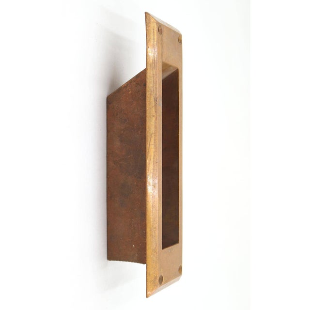 Vintage brass vertical mail slot chute in a rectangular shape that allows mail to pass cleanly through the door. Made by...