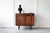 An elegant Danish cabinet in rosewood, with charming inset handles and a useful, shallow drawer. The sliding doors open to...