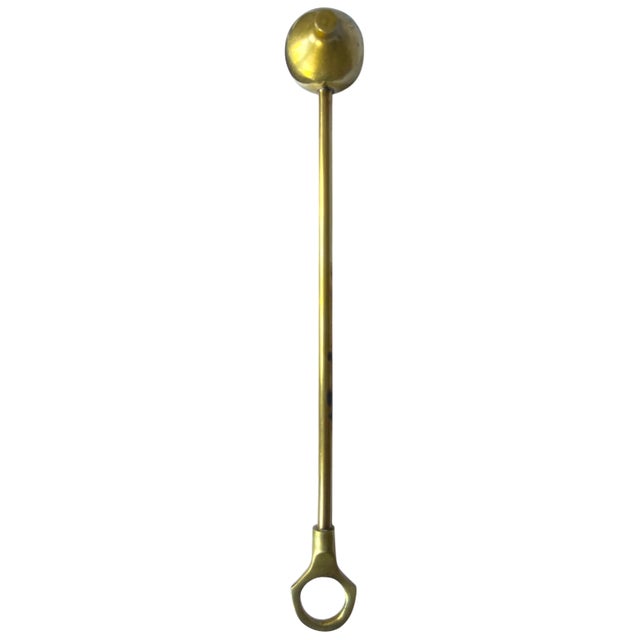 This elegant vintage solid brass candle snuffer combines sculptural simplicity with timeless function. Featuring a long,...