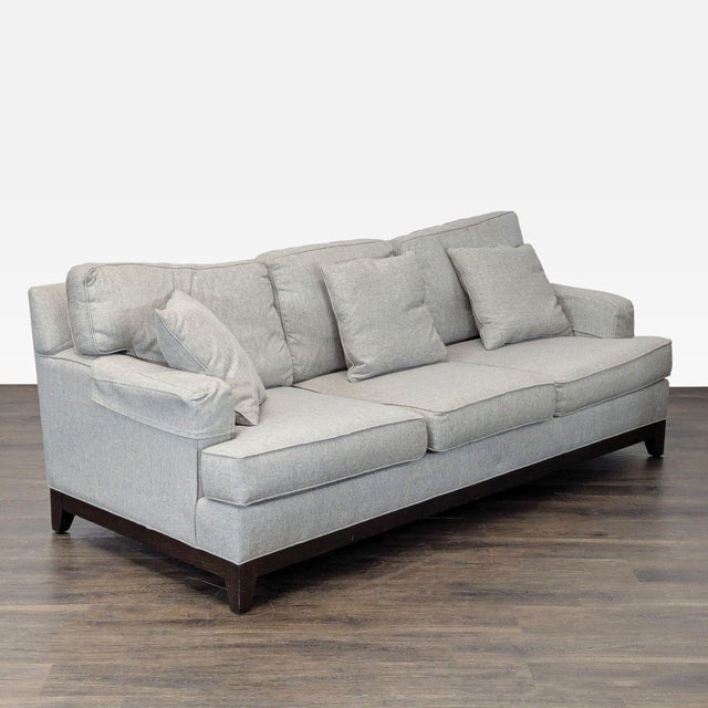 This Ethan Allen 3-seat sofa features a modern gray fabric and comes with four matching cushions for added comfort. Its...