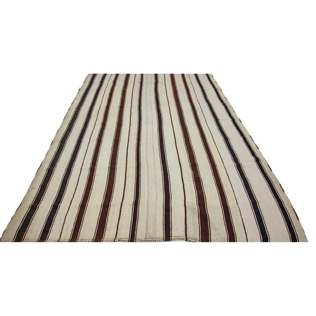 Striped vintage handwoven kilim rug from Afyon region of Turkey. Approximately 50-60 years old. In very good condition