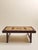 This vintage coffee table pairs a rich rosewood frame with an inset tile top in warm neutral tones. The geometric tile...
