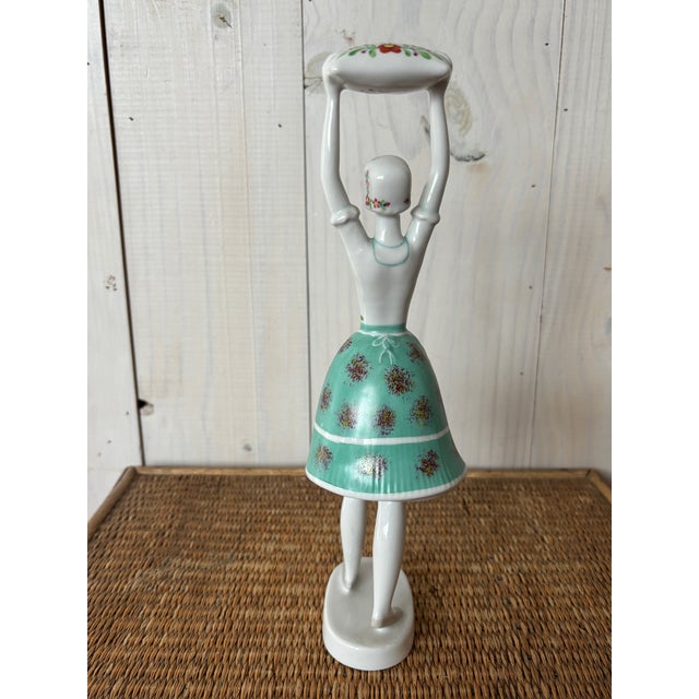 Vintage Hungarian figurine by Hollhaza! This charming handpainted lady wears a lovely turquoise skirt and apron decorated...