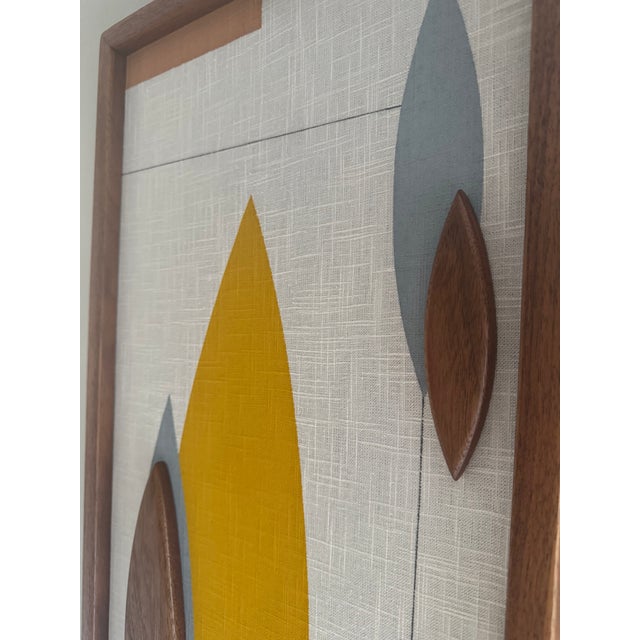 Contemporary mid-century modern mixed media wall sculpture by Modern Retrograde, purchased new in 2021. This dimensional...