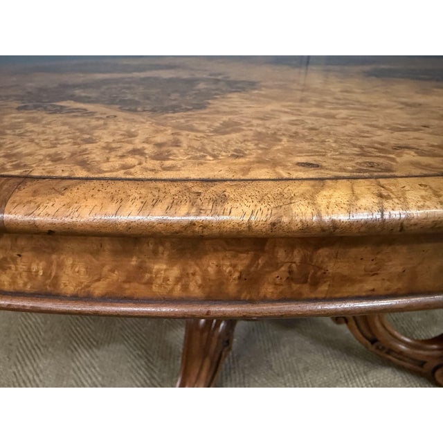 An attractive mid-Victorian period burr walnut coffee table. Of oval form and of generous proportions. Very well...
