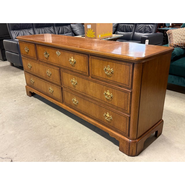 Design Plus Gallery presents the Chippendale Style Lowboy Dresser from Baker Furniture. The seven drawer dresser has a...