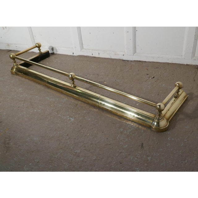 Large 19th century brass Fender This is a plain and attractive brass Fender it has a simple brass base and the brass rail...