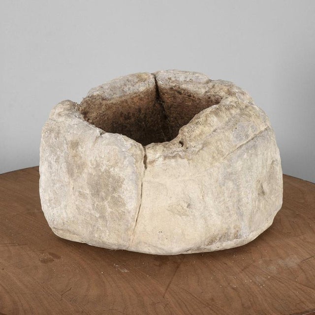 This stone basin, with its rounded and irregular shapes, is a suggestive example of an ancient artefact, ideal for...