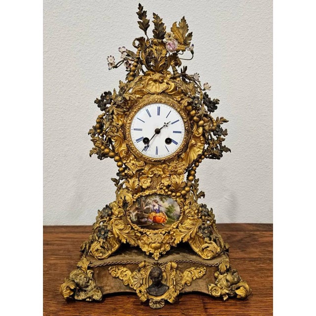 A breathtaking antique French Belle Époque period (1871-1914) porcelain mounted mixed metal mantel clock. Born in France...
