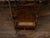 An English wooden trolley from the 19th century, with three shelves, low drawer and turned supports. Created in England...