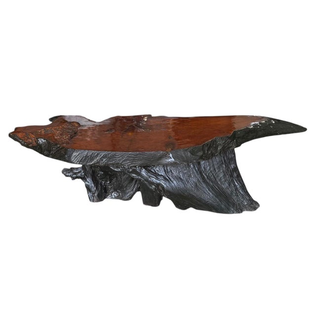 A mid-century coffee table depicting the more organic side of modernism. Crafted of redwood with top lacquered and edge...