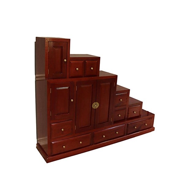 This fantastic six step Tansu chest has nine drawers and three cabinets-- a total of twelve storage compartments! The...