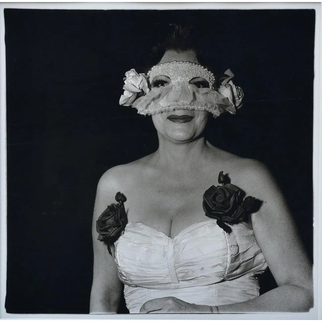Diane Arbus (American, 1923-1971) Lady at a Masked Ball with Two Roses on her Dress, N.Y.C. 1967, printed in 1972, ink...