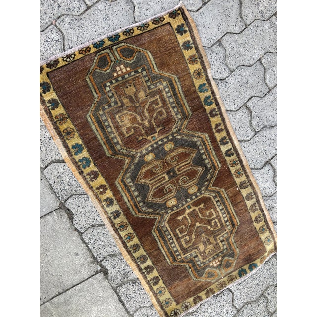 This is a vintage Turkish Oushak rug from the 1960s. The piece was hand-knotted.